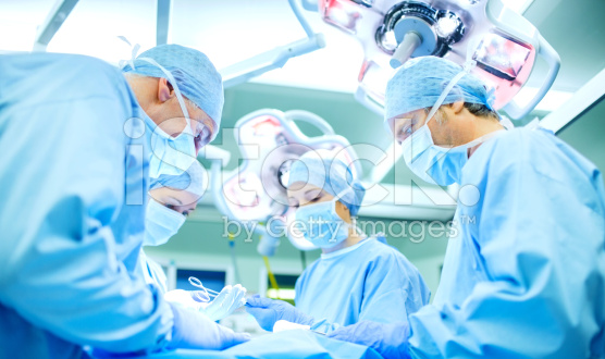 stock-photo-57228784-surgeons-performing-surgery-on-patient-in-operating-room.jpg